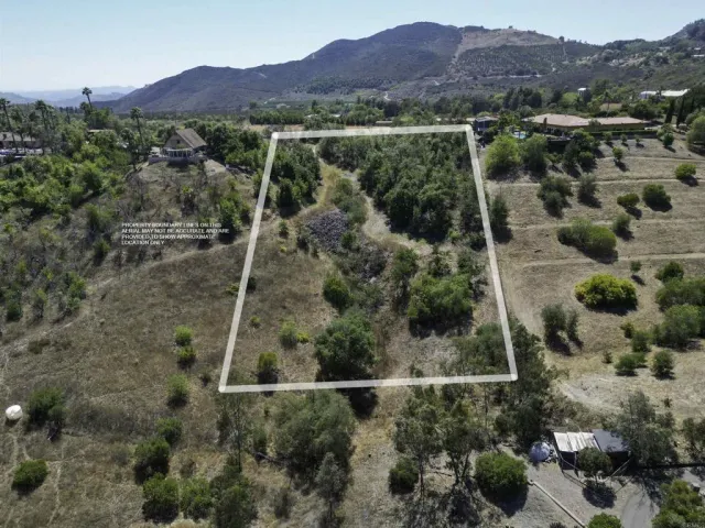 an aerial view of residential house with outdoor space