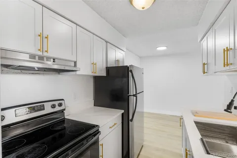 a kitchen with a stove and a refrigerator