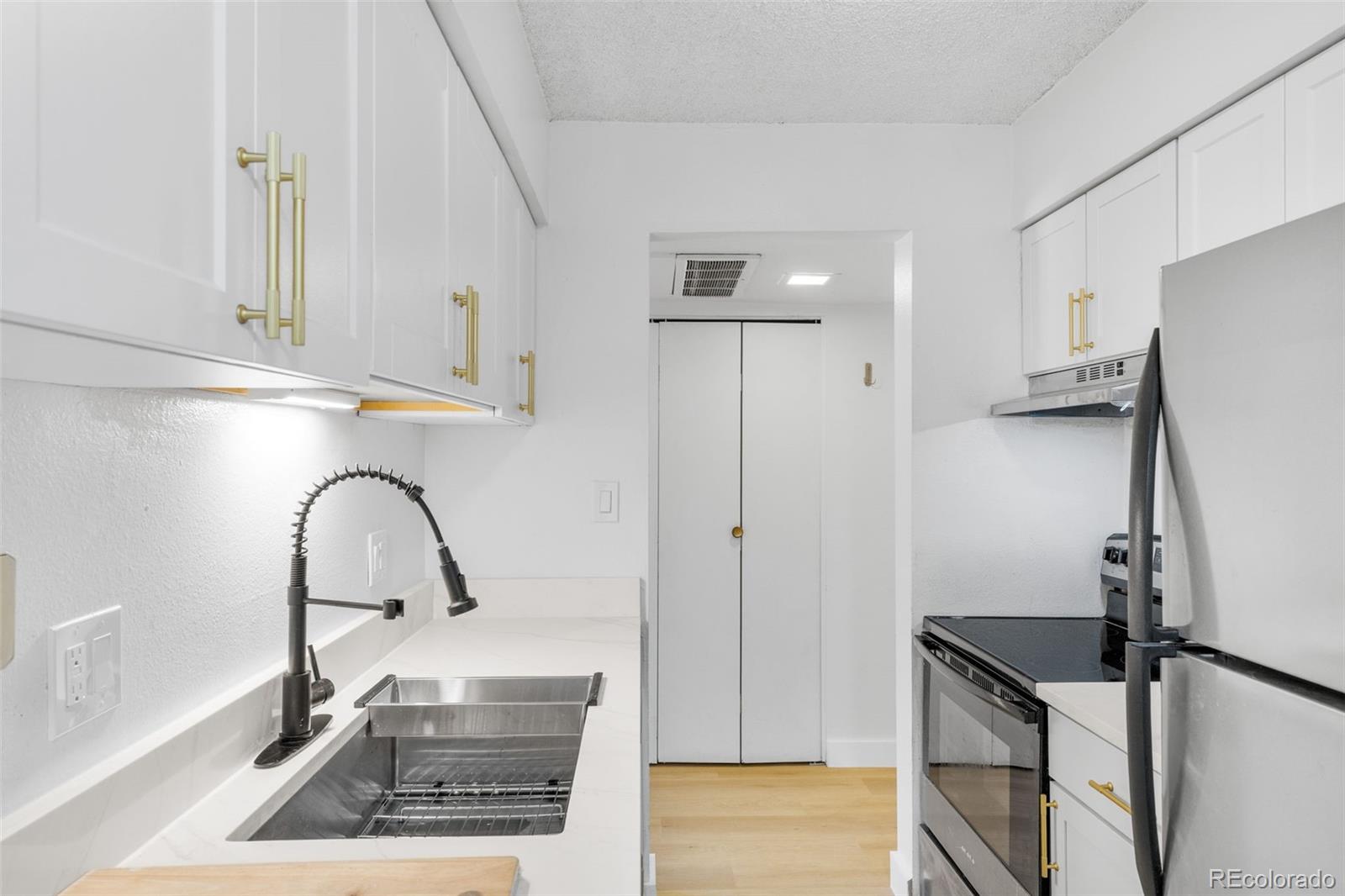 7755 East Quincy Avenue, Unit 303A5 Denver, CO 80237 - Photo 15 of 35 a picture of a sink and cabinets