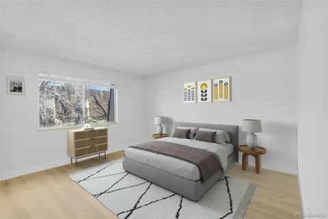 a bedroom with a bed and a cabinets