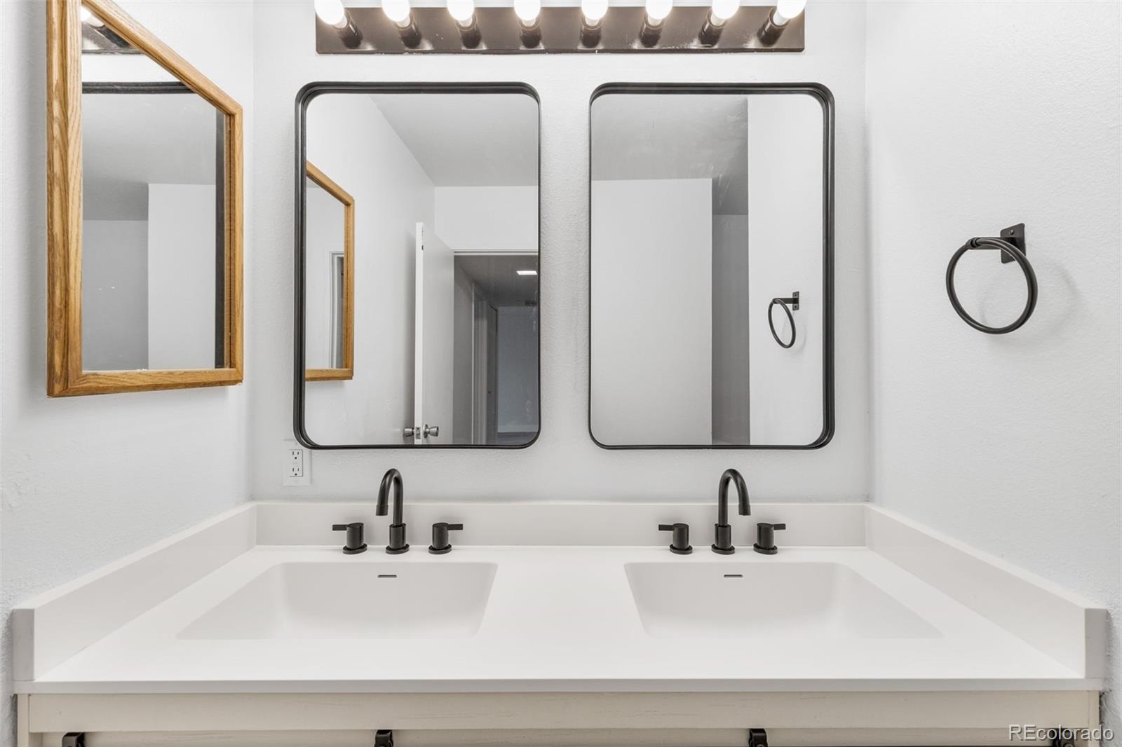 7755 East Quincy Avenue, Unit 303A5 Denver, CO 80237 - Photo 21 of 35 a bathroom with a sink and a mirror