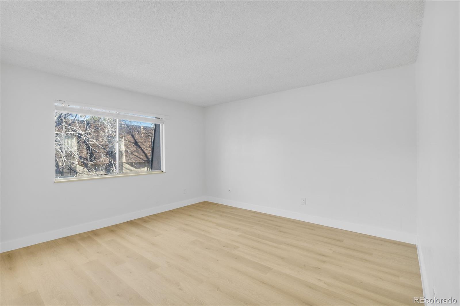 7755 East Quincy Avenue, Unit 303A5 Denver, CO 80237 - Photo 24 of 35 a view of an empty room with a window