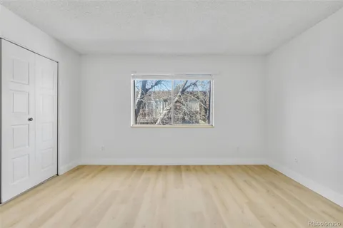 an empty room with a bench