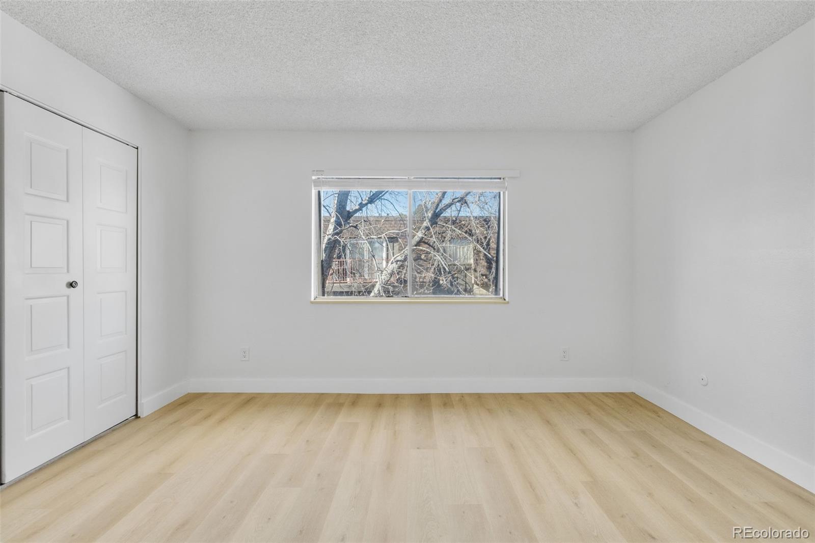 7755 East Quincy Avenue, Unit 303A5 Denver, CO 80237 - Photo 25 of 35 an empty room with a bench