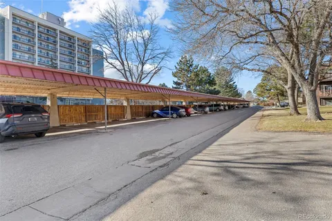 a view of a car park in front of a building