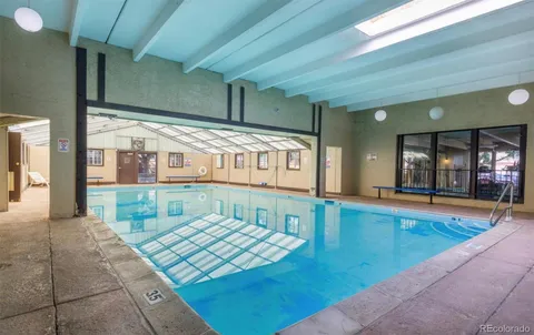 a view of swimming pool with outdoor seating