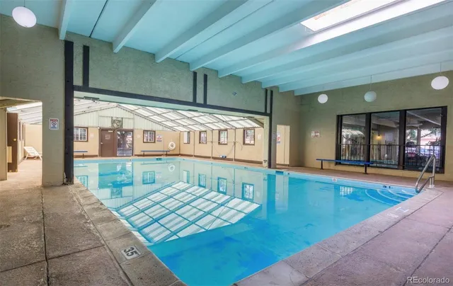 a view of swimming pool with outdoor seating