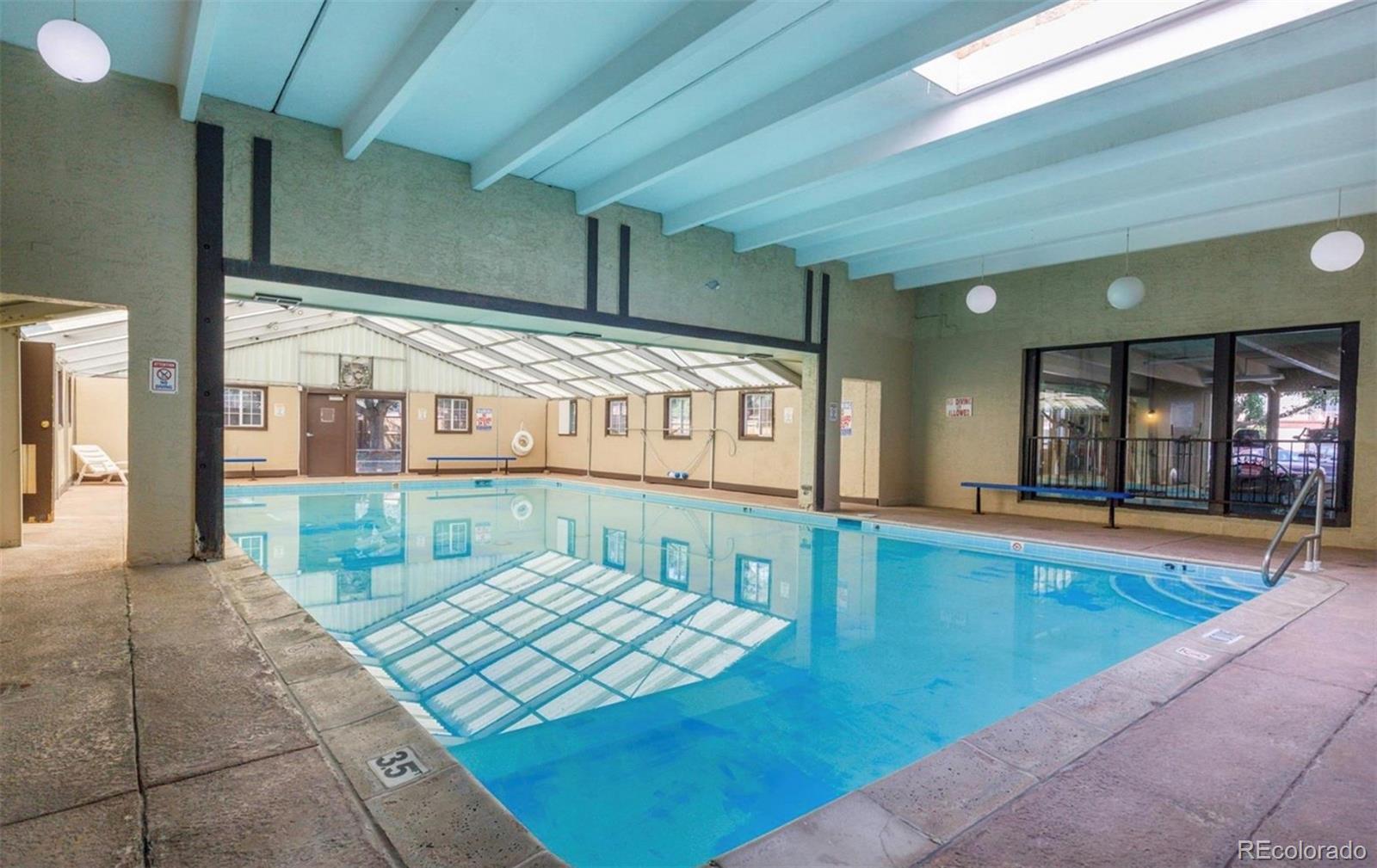 7755 East Quincy Avenue, Unit 303A5 Denver, CO 80237 - Photo 33 of 35 a view of swimming pool with outdoor seating