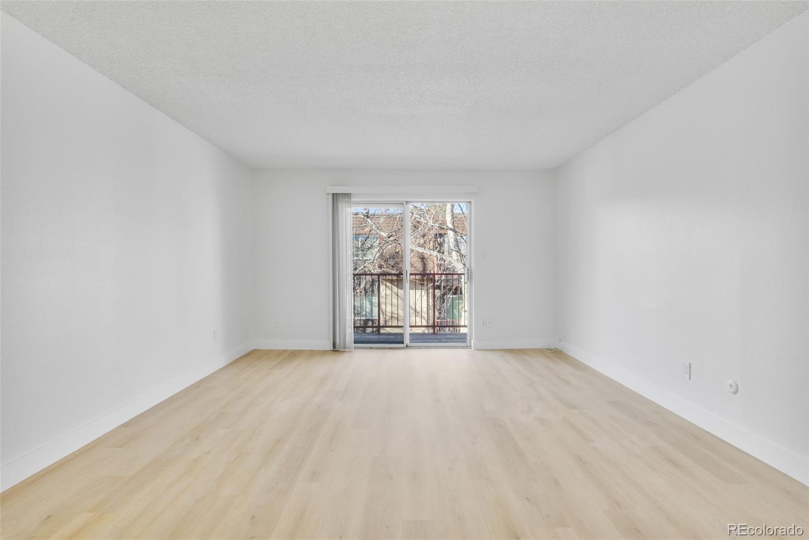 7755 East Quincy Avenue, Unit 303A5 Denver, CO 80237 - Photo 6 of 35 a view of an empty room with a window