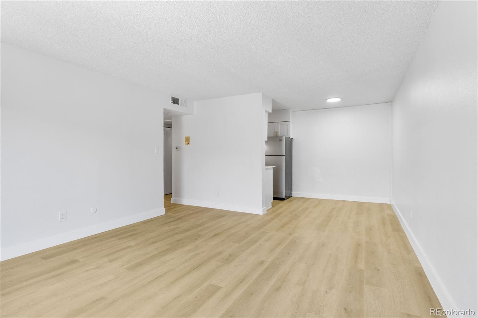 7755 East Quincy Avenue, Unit 303A5 Denver, CO 80237 - Photo 10 of 35 a view of empty room with a fireplace