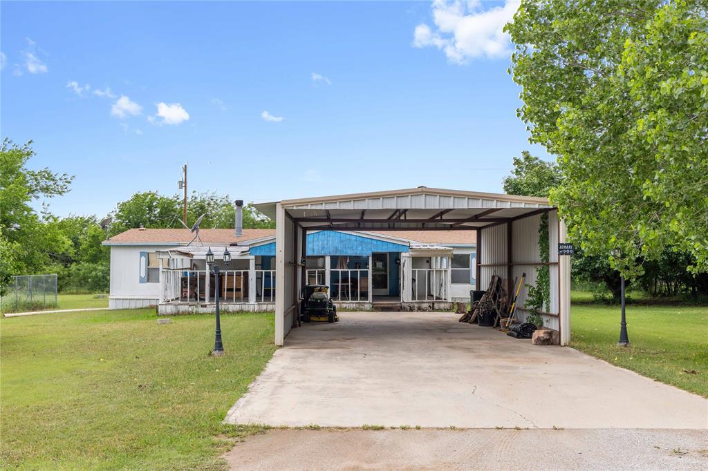 210 7th Street Blanket, TX 76432 - Photo 1 of 33 a view of a house with a backyard patio and a garden