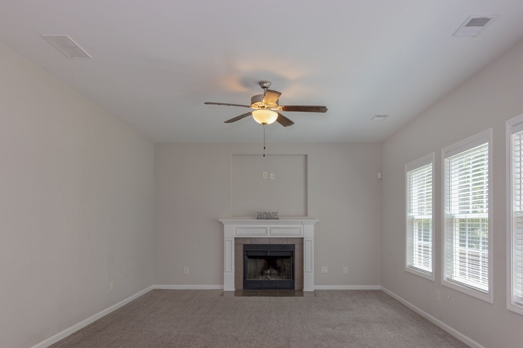 104 Pin Oak Way Hamilton, GA 31811 - Photo 13 of 41 a living room with furniture and a fireplace