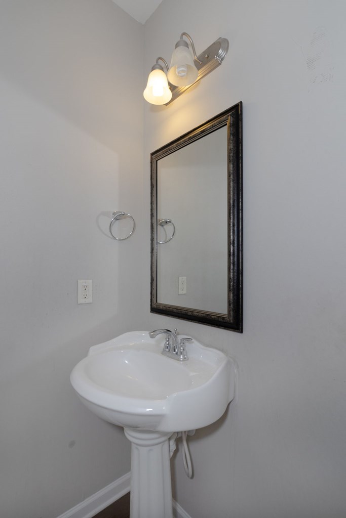 104 Pin Oak Way Hamilton, GA 31811 - Photo 15 of 41 a bathroom with a sink and a mirror