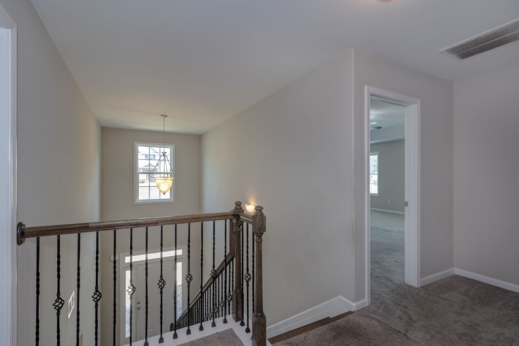 104 Pin Oak Way Hamilton, GA 31811 - Photo 17 of 41 a view of a hallway with wooden floor and a window