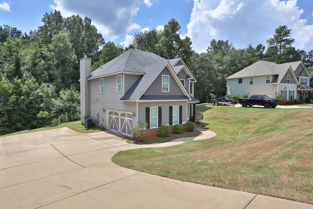 104 Pin Oak Way Hamilton, GA 31811 - Photo 2 of 41 a house with yard in front of it