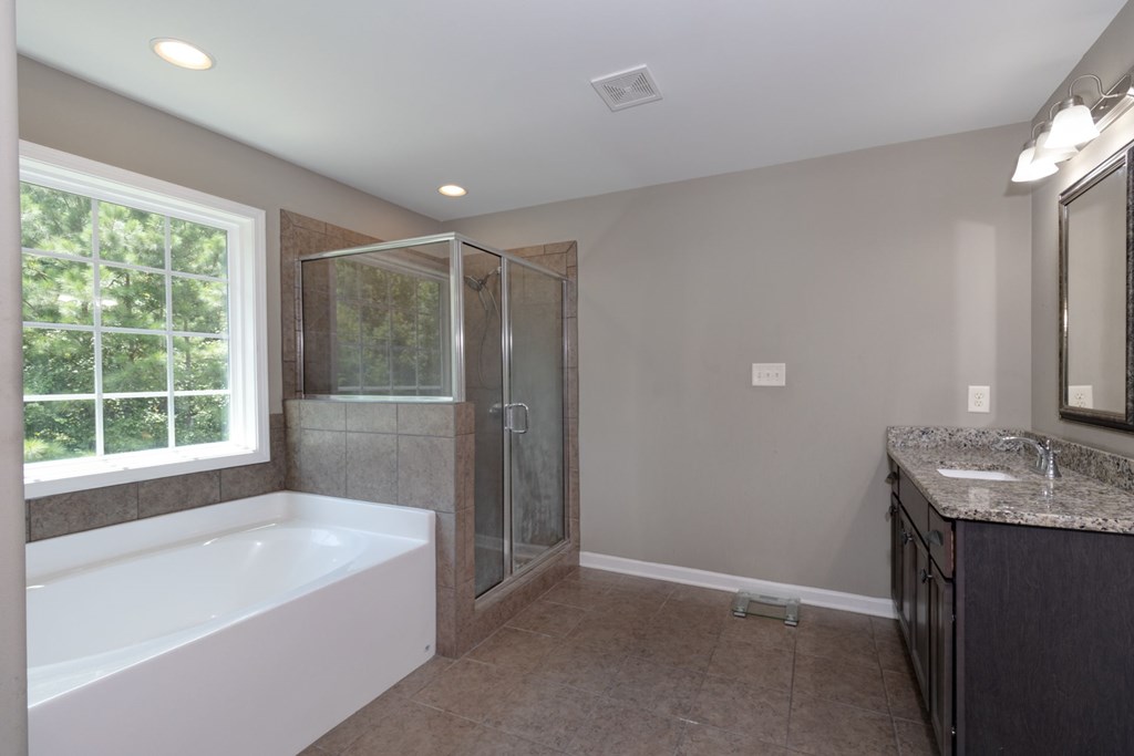 104 Pin Oak Way Hamilton, GA 31811 - Photo 22 of 41 a bathroom with a bathtub and a sink