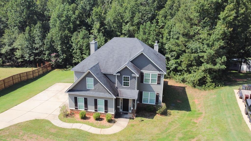 104 Pin Oak Way Hamilton, GA 31811 - Photo 35 of 41 a front view of a house with yard porch and green space