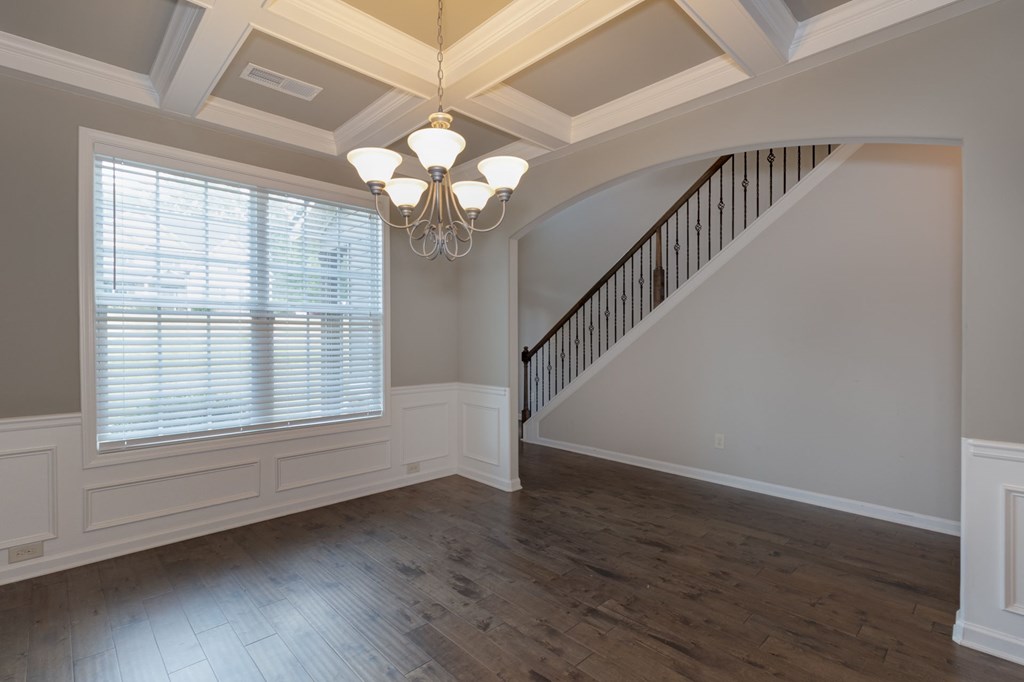 104 Pin Oak Way Hamilton, GA 31811 - Photo 4 of 41 an empty room with wooden floor fan and windows