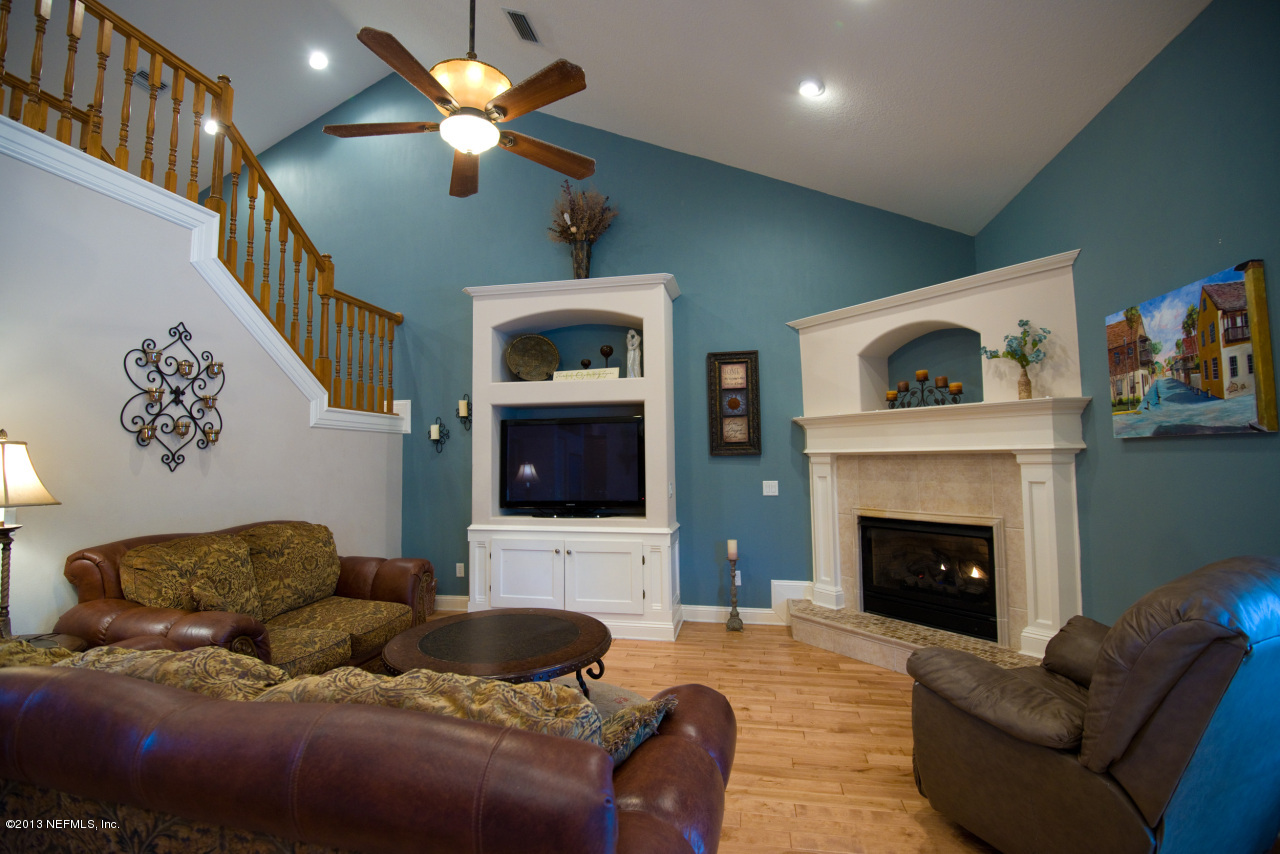3385 Kings Road South St. Augustine, FL 32086 - Photo 14 of 36 a living room with furniture and a fireplace