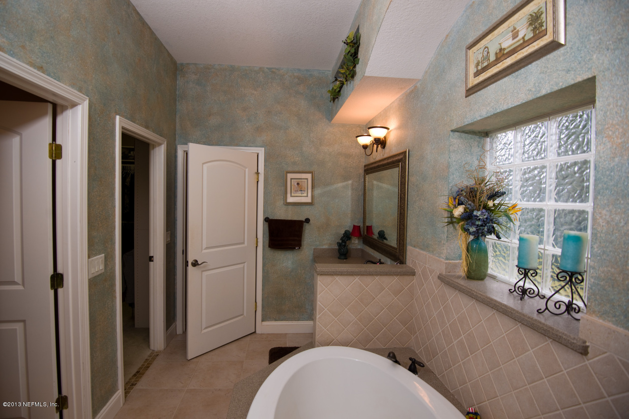 3385 Kings Road South St. Augustine, FL 32086 - Photo 18 of 36 a bathroom with a sink a toilet and shower