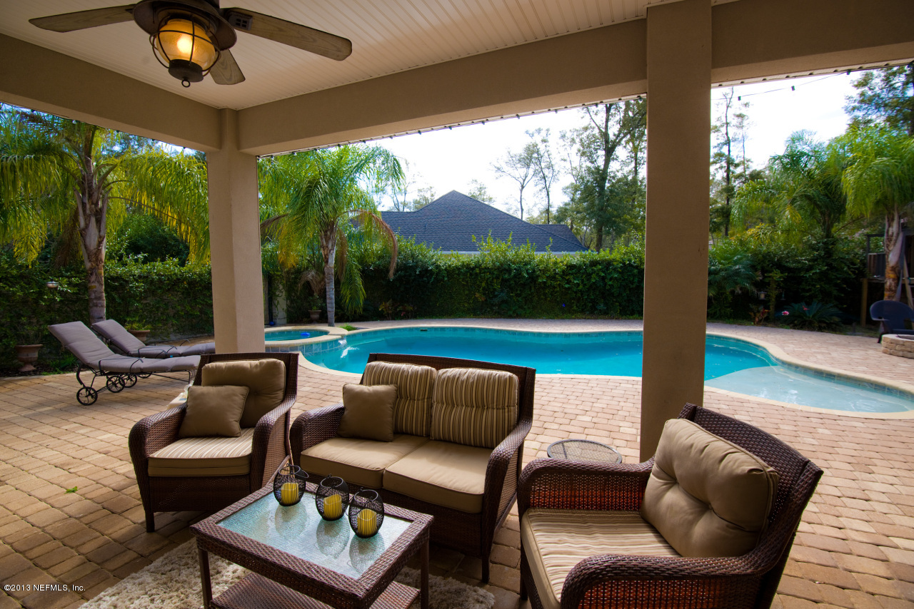 3385 Kings Road South St. Augustine, FL 32086 - Photo 2 of 36 a roof deck with couches fire pit and outdoor seating