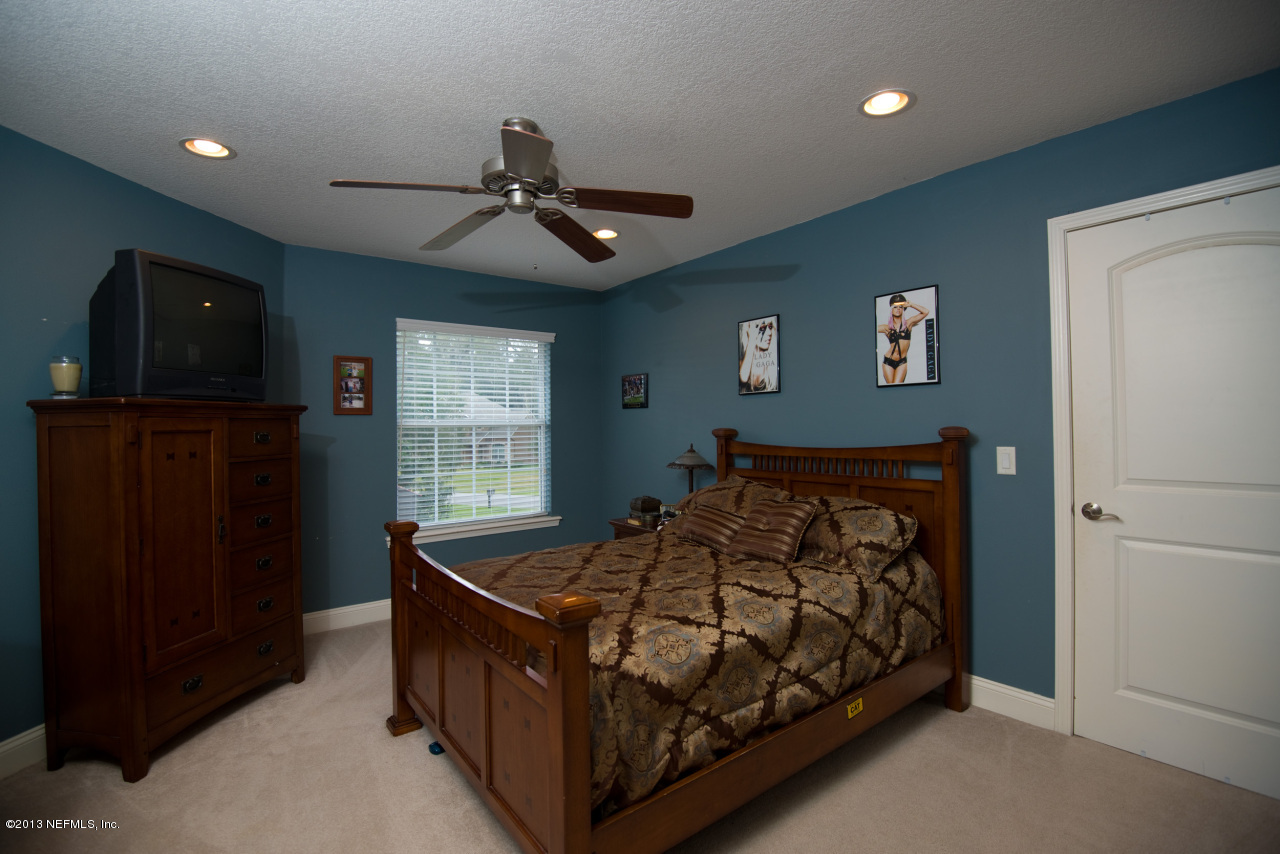 3385 Kings Road South St. Augustine, FL 32086 - Photo 24 of 36 a bed room with a bed and a window