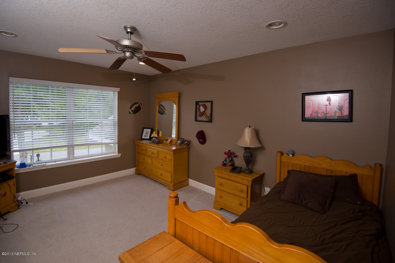 3385 Kings Road South St. Augustine, FL 32086 - Photo 27 of 36 a living room with furniture and a window
