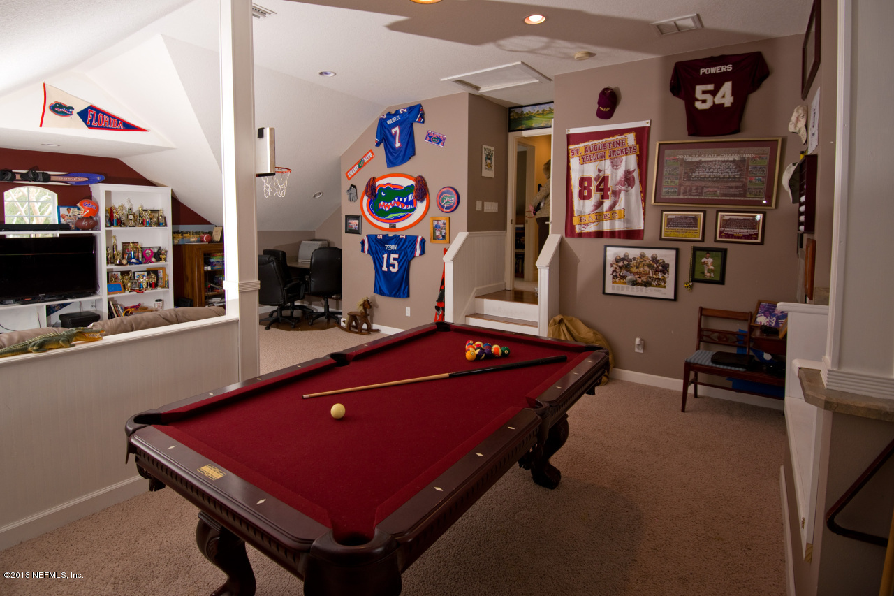 3385 Kings Road South St. Augustine, FL 32086 - Photo 29 of 36 a room with furniture pool and flat screen tv