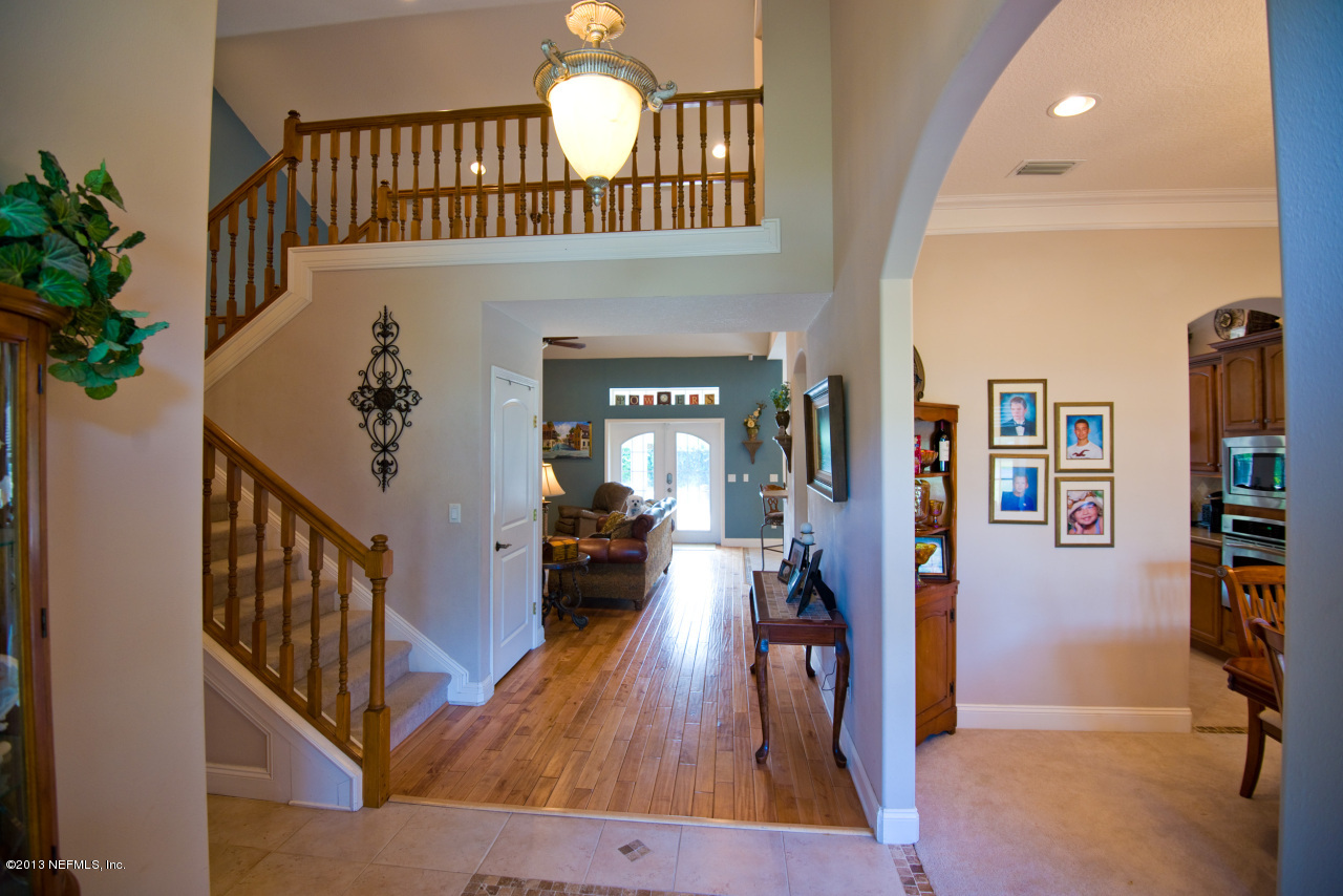 3385 Kings Road South St. Augustine, FL 32086 - Photo 6 of 36 a view of a livingroom with furniture and hardwood floor