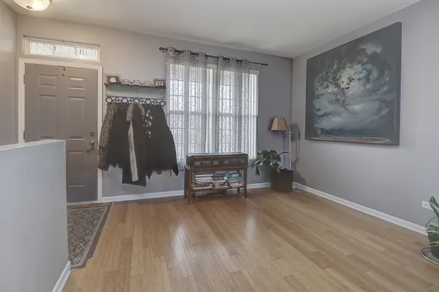 a view of a room with wooden floor and a cabinet