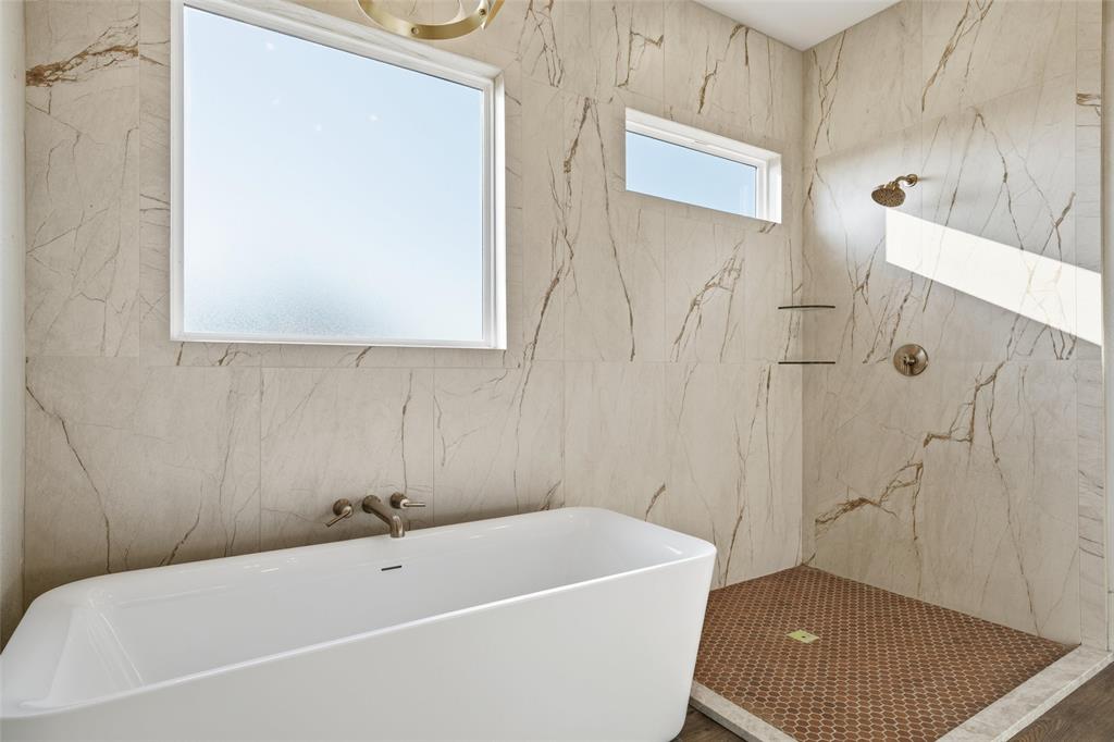 348 Lacek Mill Road China Spring, TX 76633 - Photo 28 of 40 a bathroom with a bathtub and shower
