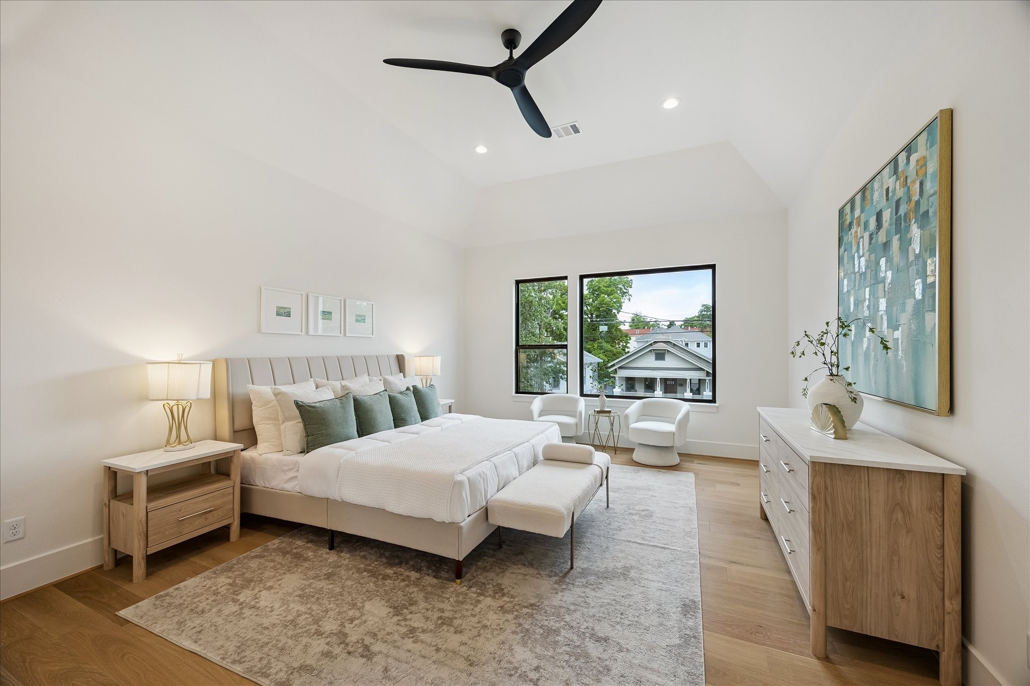 122 East 4th Street Houston, TX 77007 - Photo 20 of 38 Primary suite – features a raised ceiling, ceiling fan, and wood flooring.