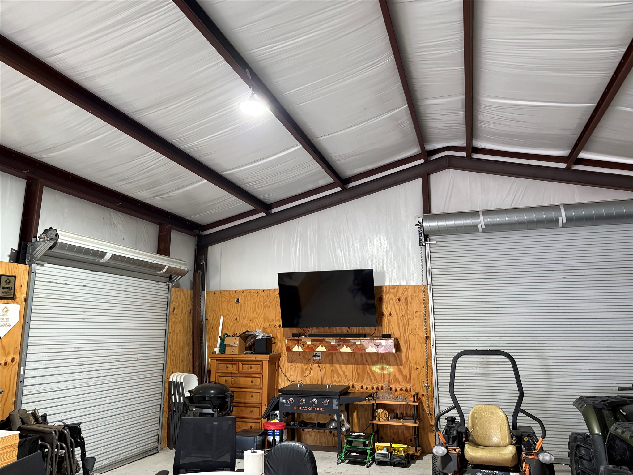 1512 Panther Loop Pflugerville, TX 78660 - Photo 35 of 40 Secure storage solution with roll-up doors and a sturdy metal frame.