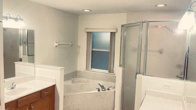 21962 Southwest Nautilus Boulevard Dunnellon, FL 34431 - Photo 6 of 12 a bathroom with a sink and a mirror