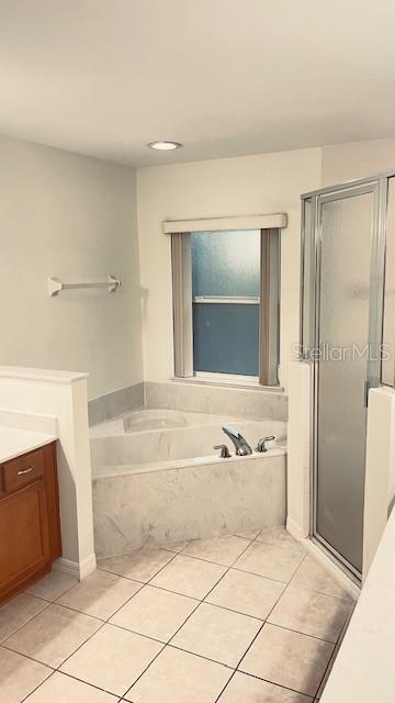 21962 Southwest Nautilus Boulevard Dunnellon, FL 34431 - Photo 8 of 12 a bathroom with a bathtub and a shower