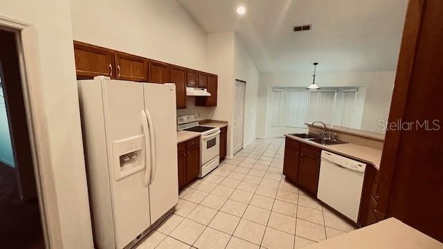 21962 Southwest Nautilus Boulevard Dunnellon, FL 34431 - Photo 10 of 12 a kitchen with stainless steel appliances a refrigerator stove and sink