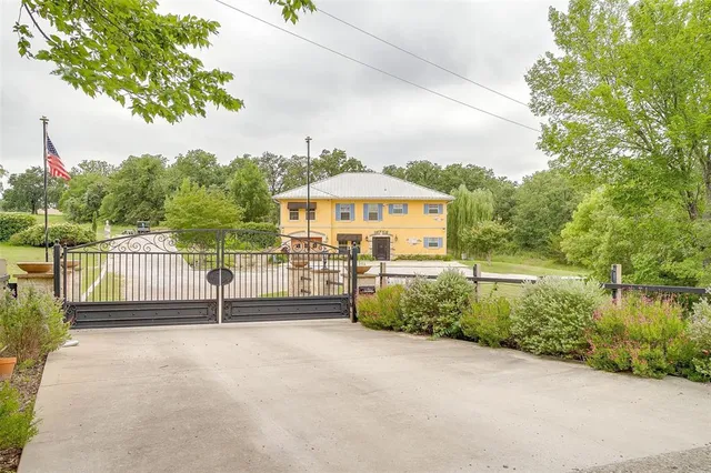 a view of a fence in front of house