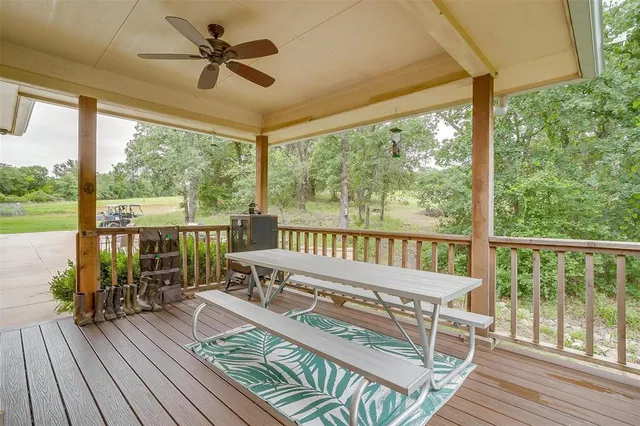 a balcony with furniture and wooden floor