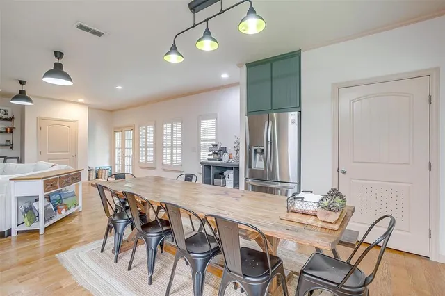 a kitchen with granite countertop cabinets and wooden floor