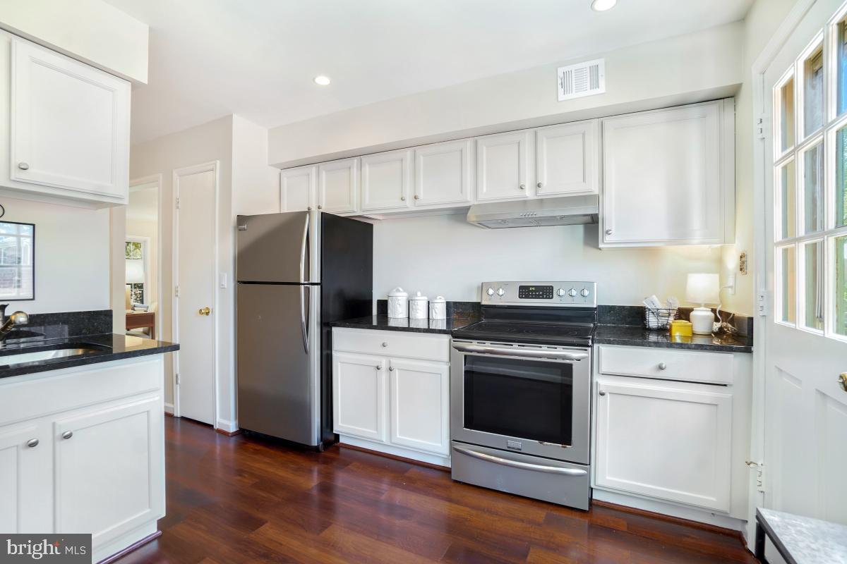 8345 Forrester Boulevard Springfield, VA 22152 - Photo 12 of 30 The kitchen features stainless appliances