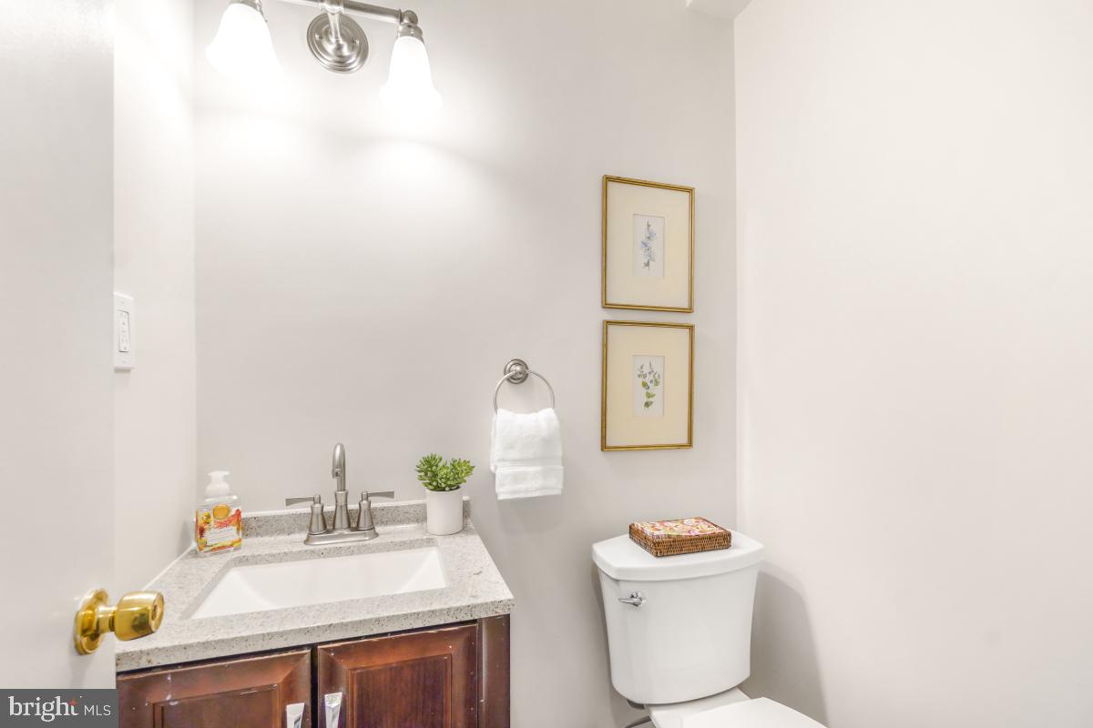 8345 Forrester Boulevard Springfield, VA 22152 - Photo 14 of 30 Half bath with granite vanity and bright lighting