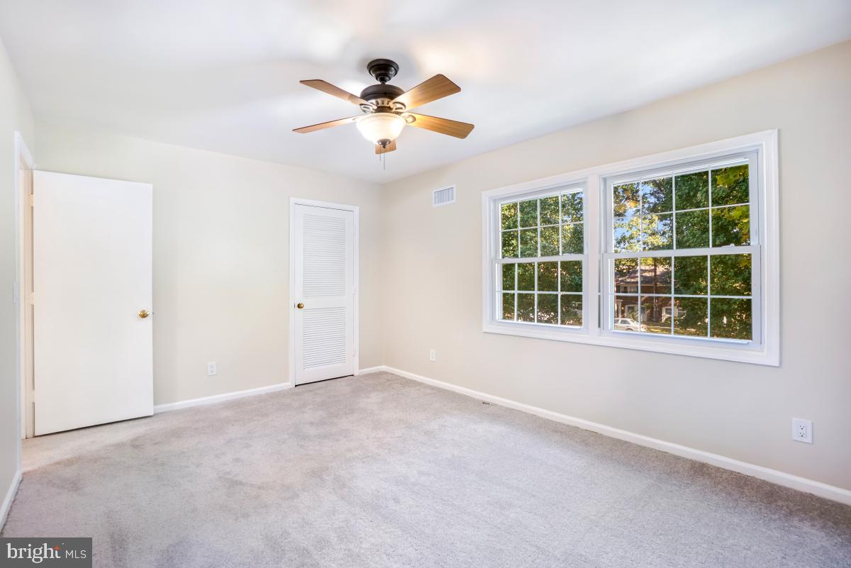 8345 Forrester Boulevard Springfield, VA 22152 - Photo 16 of 30 Primary bedroom with walk-closet and ensuite bath.