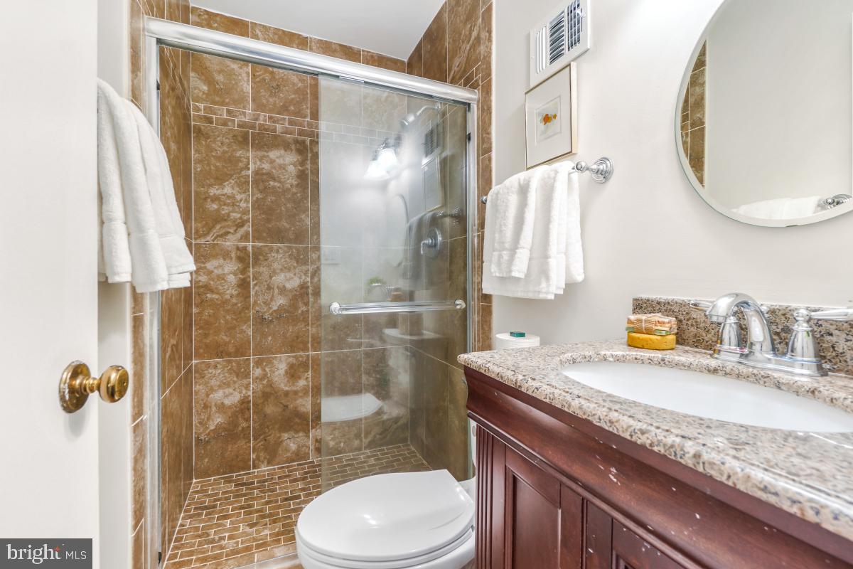 8345 Forrester Boulevard Springfield, VA 22152 - Photo 18 of 30 Bathroom with granite vanity and walk-in shower