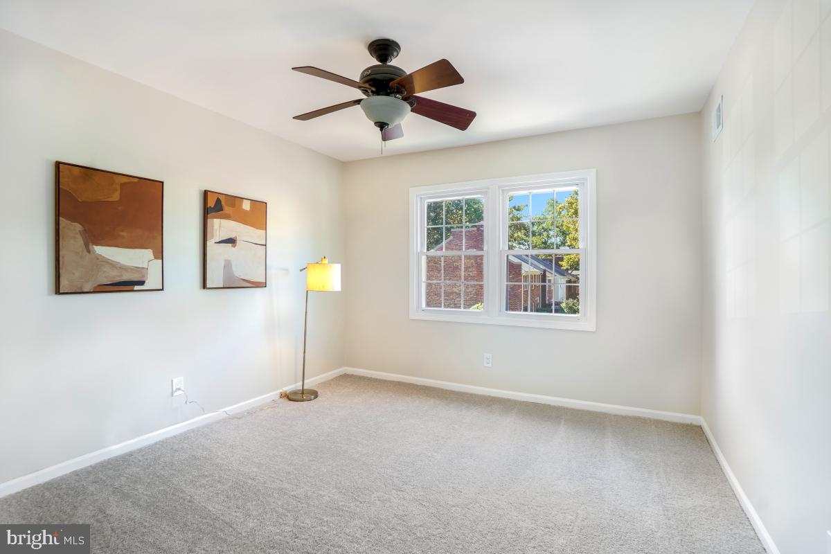 8345 Forrester Boulevard Springfield, VA 22152 - Photo 20 of 30 Bedroom #2 with natural light and ceiling fan.