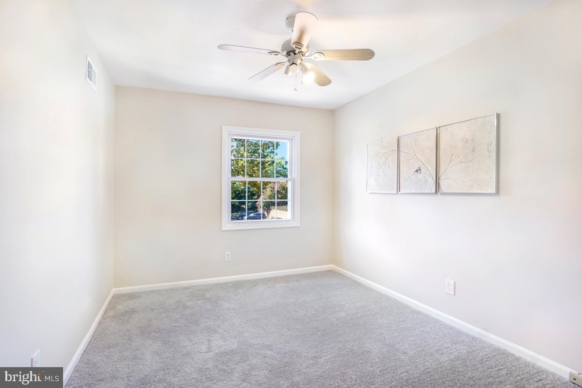8345 Forrester Boulevard Springfield, VA 22152 - Photo 21 of 30 Third bedroom with bright window and ceiling fan
