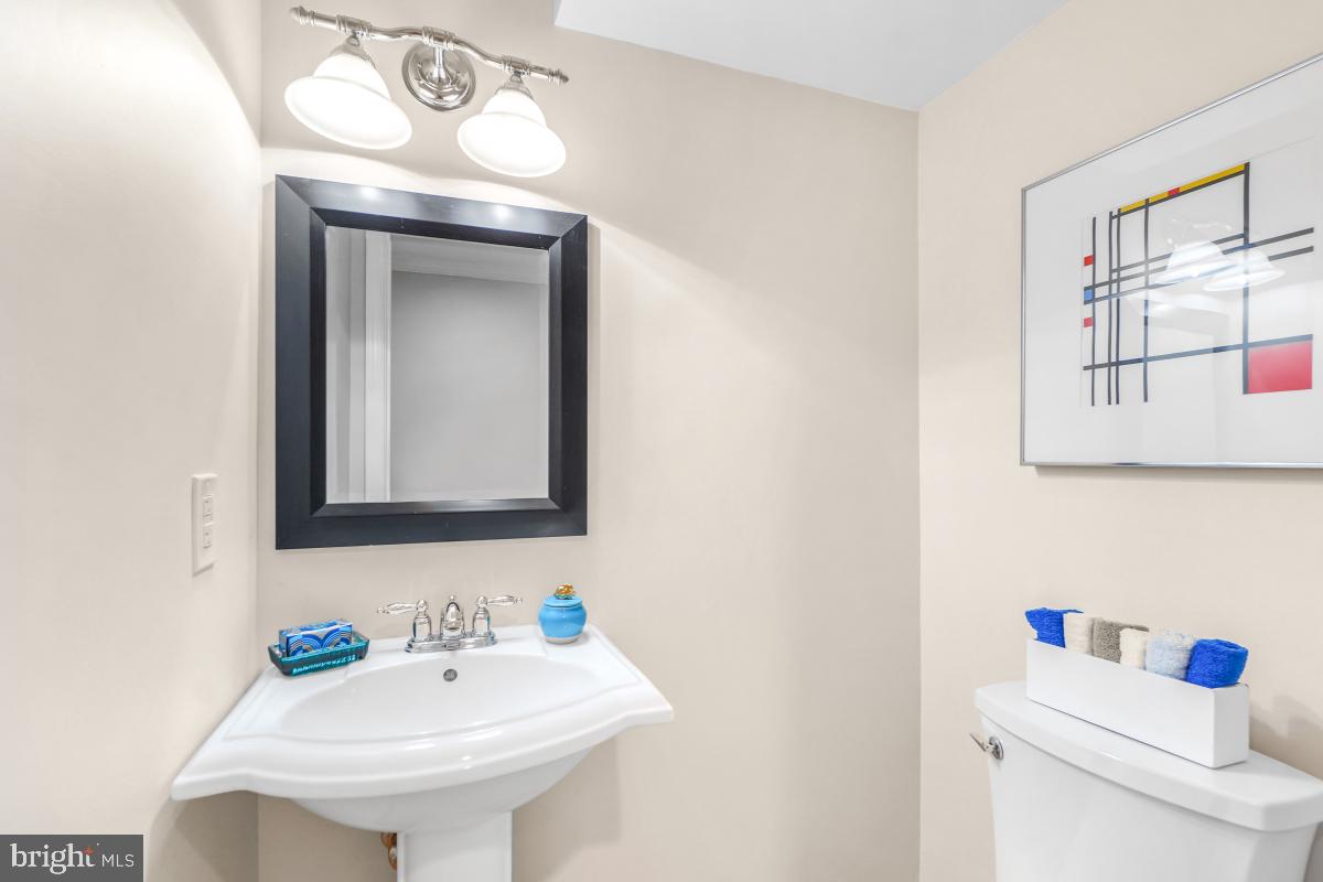 8345 Forrester Boulevard Springfield, VA 22152 - Photo 24 of 30 Basement half bath with stylish mirror and sink