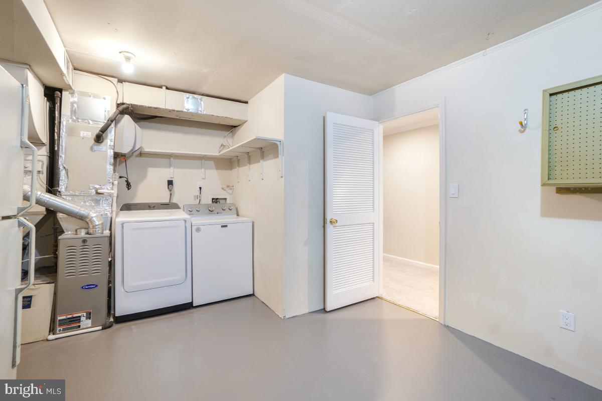 8345 Forrester Boulevard Springfield, VA 22152 - Photo 28 of 30 Laundry room and lots of storage.