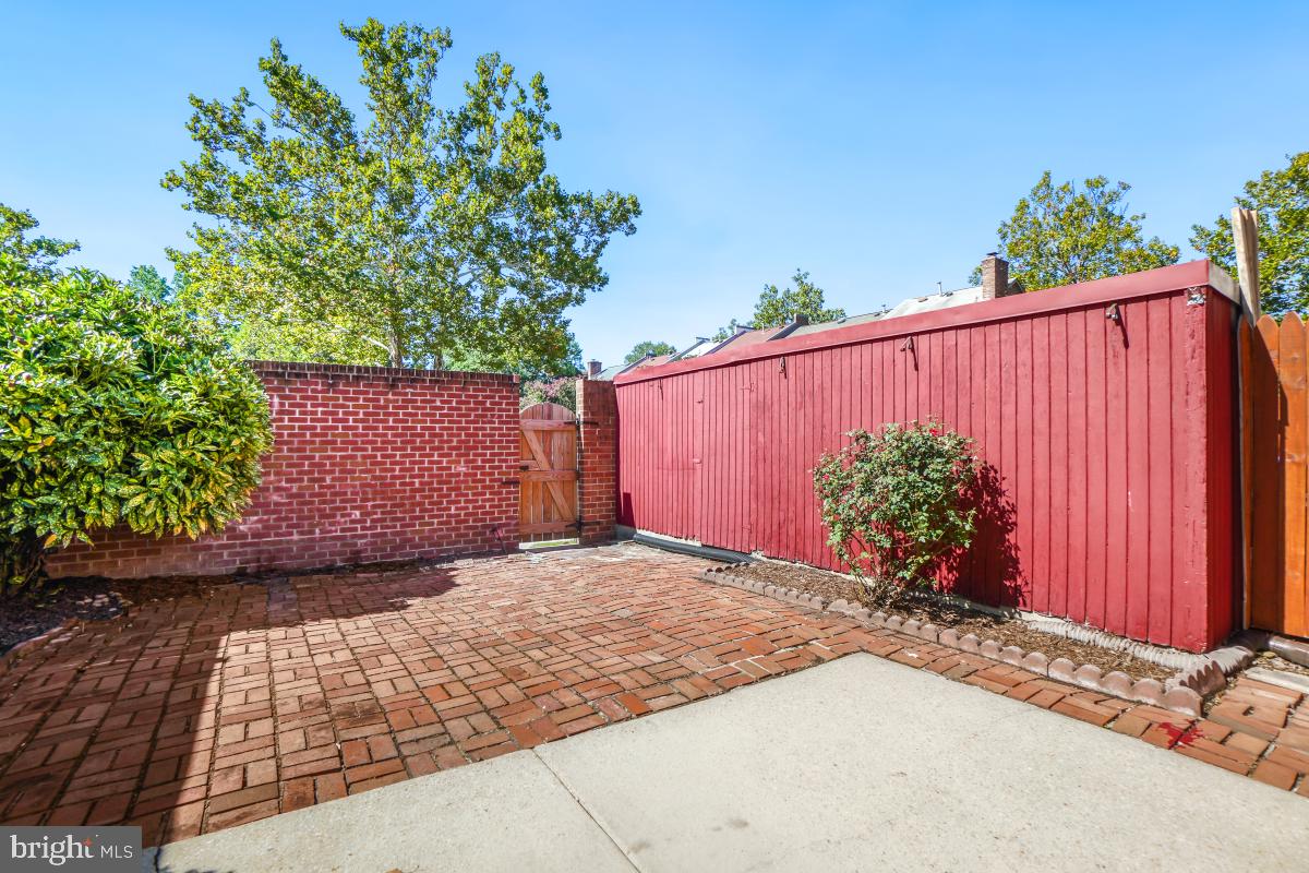 8345 Forrester Boulevard Springfield, VA 22152 - Photo 29 of 30 Private fenced backyard with brick patio and shed.