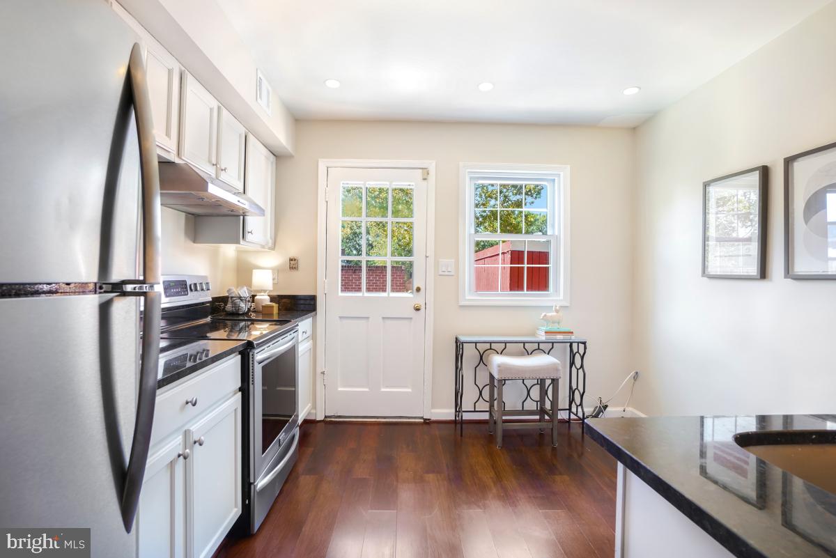 8345 Forrester Boulevard Springfield, VA 22152 - Photo 10 of 30 Spacious kitchen has large windows and yard access