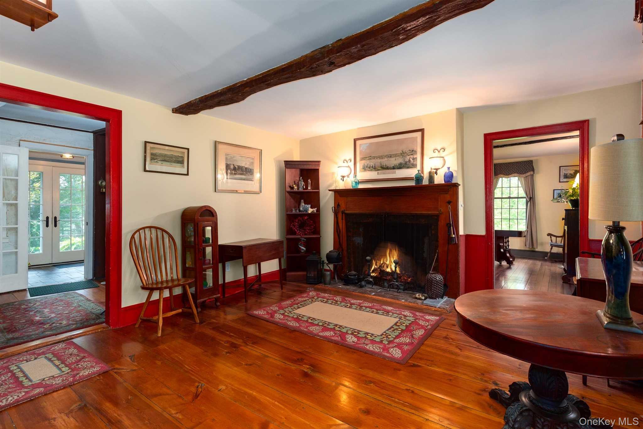 1598 Jackson Corners Road Red Hook, NY 12571 - Photo 11 of 36 a living room with furniture and a fireplace